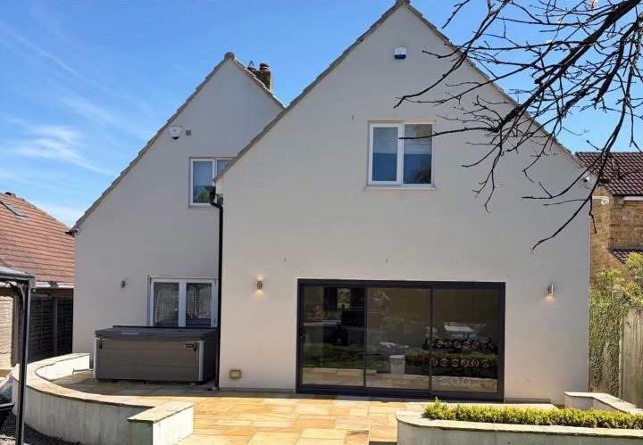 Rear elevation of a detached rendered house after soft wash