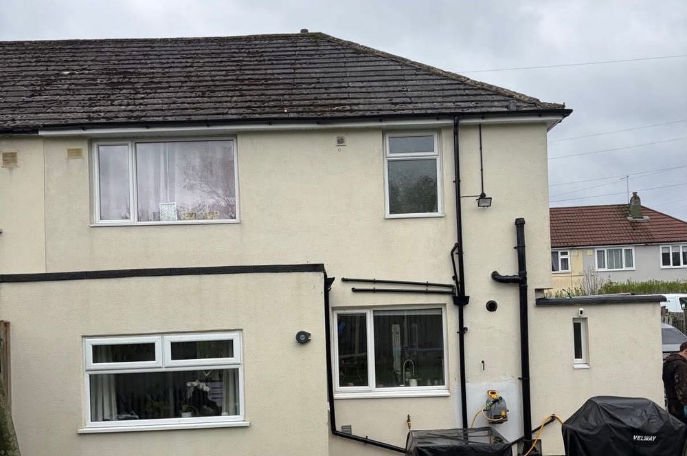 Rear of a rendered semi-detached house after soft wash